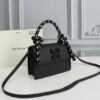 Off-White Leather Insert Black Gummy with Metallic Black Arrows At Front. Rope Handle Jitney 1.4 Shoulder Bag (D88532 Black)